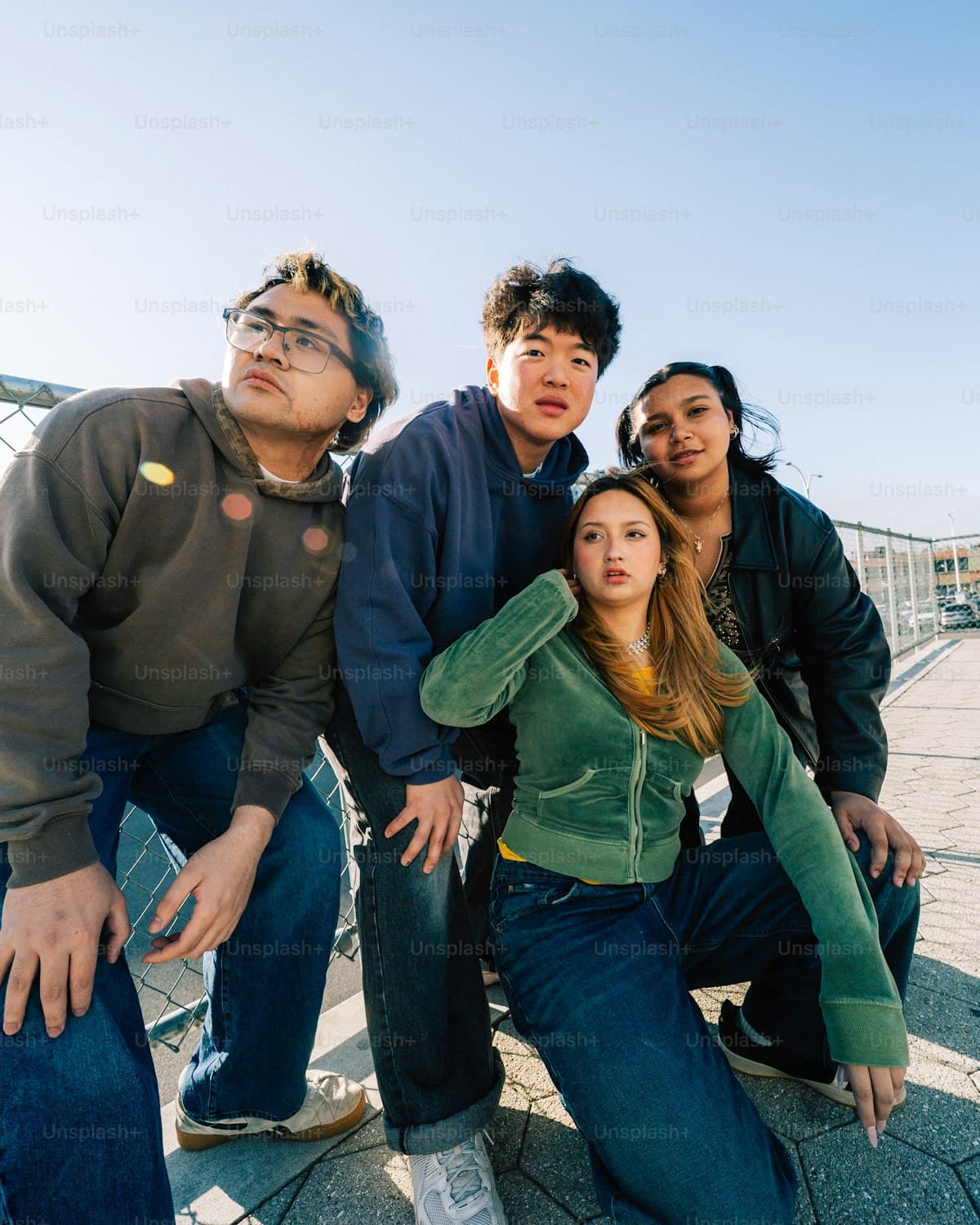 Friends laughing together outdoors.