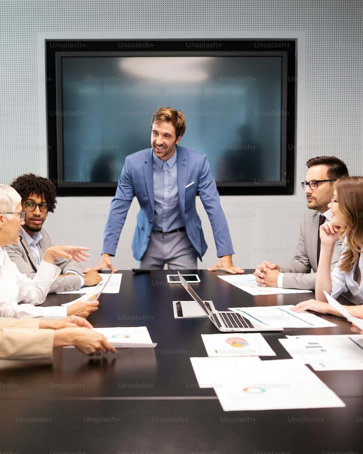 A diverse group collaborating around a table.